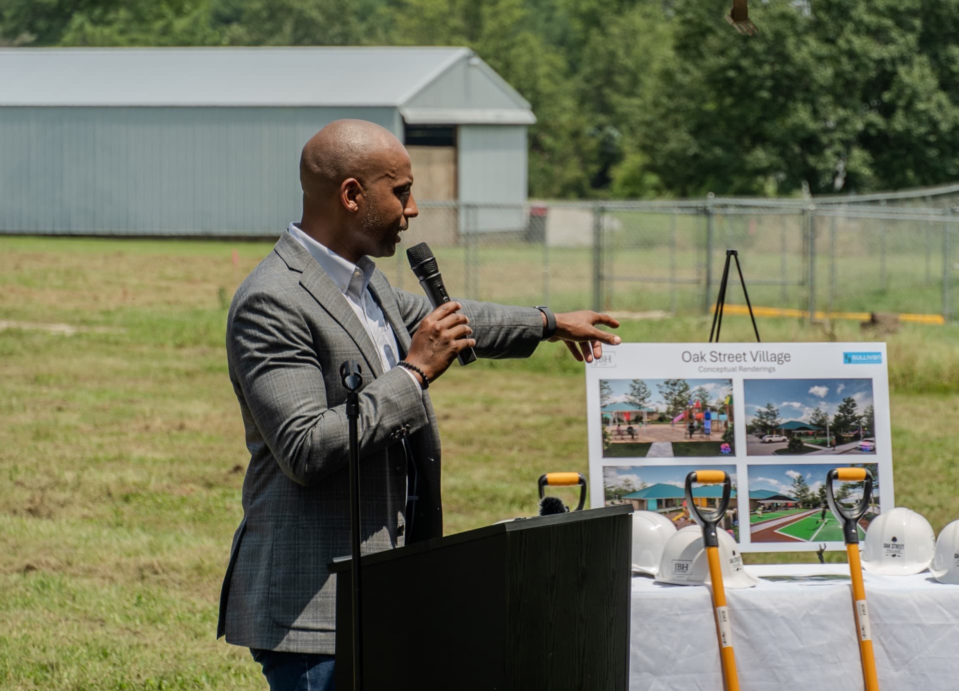 Joe White at the podium presenting the Oak Street Village project renderings