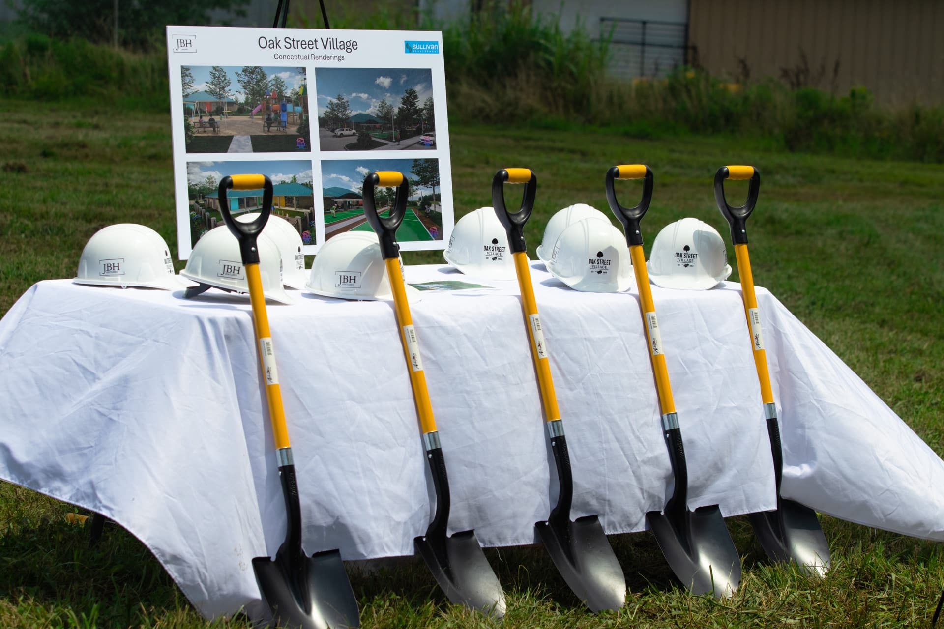 Ceremonial shovels and hard hats at the Oak Street Village groundbreaking