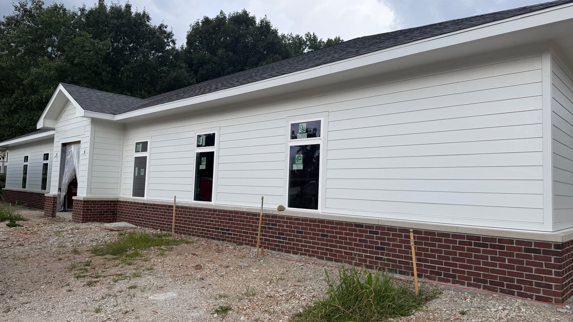 Brick-and-siding exterior nearing completion at Oak Street Village